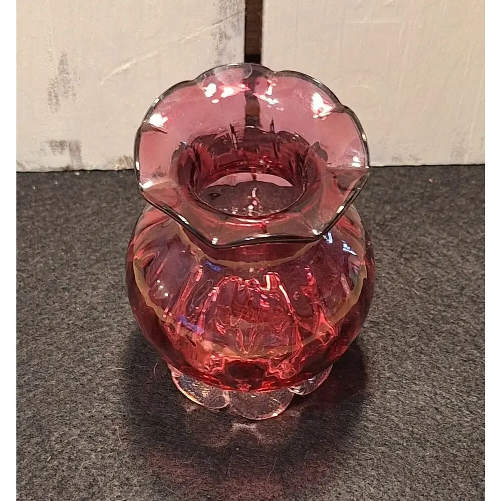 Vintage med century cranberry vase. Thumbprint base and ruffed top.